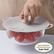 Hand placing a silicone lid on a bowl of tomatoes