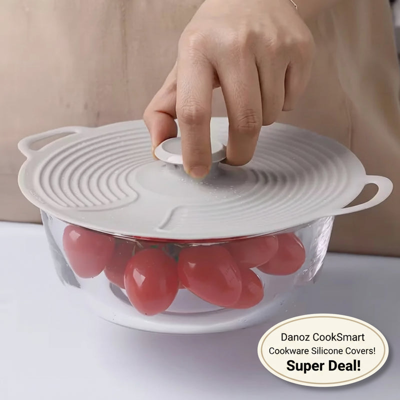 Hand placing a silicone lid on a bowl of tomatoes