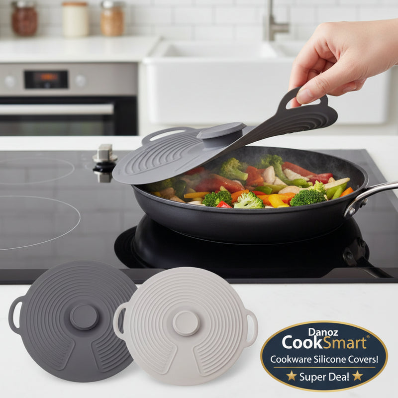 Silicone lid being placed on a frying pan with food, surrounded by additional silicone lids.