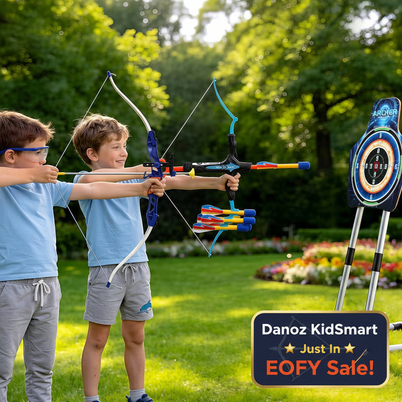 Two children playing with archery sets in a park
