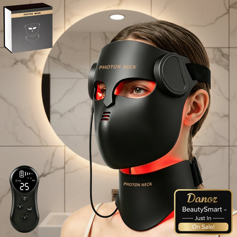 Person wearing a black photon mask and neck device with a remote control, and packaging in the background.