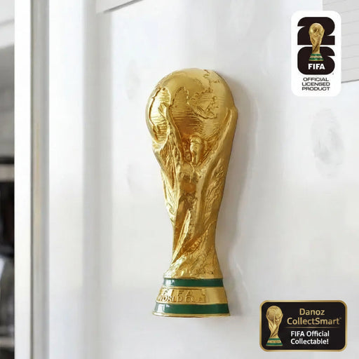 Gold FIFA World Cup trophy on a white background