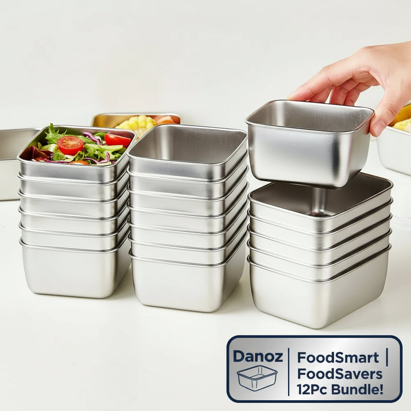 Stack of metal food containers with a hand lifting one, on a kitchen counter.