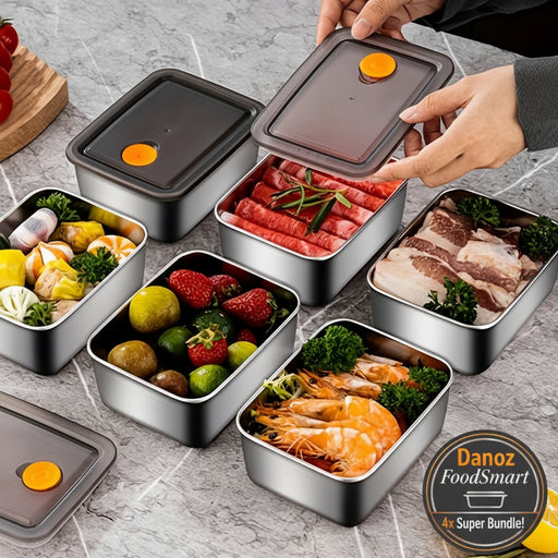 Set of metal food containers with various foods on a gray surface