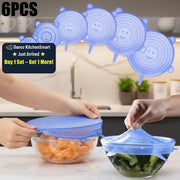 Set of six blue silicone stretch lids being used on bowls with fruits and vegetables.