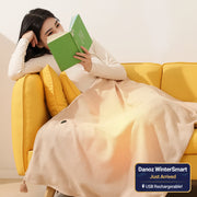 Woman reading a green book on a yellow couch with a heated pink blanket