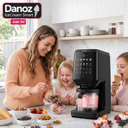 Woman and children in a kitchen with a Ice cream -making machine, surrounded by food items.