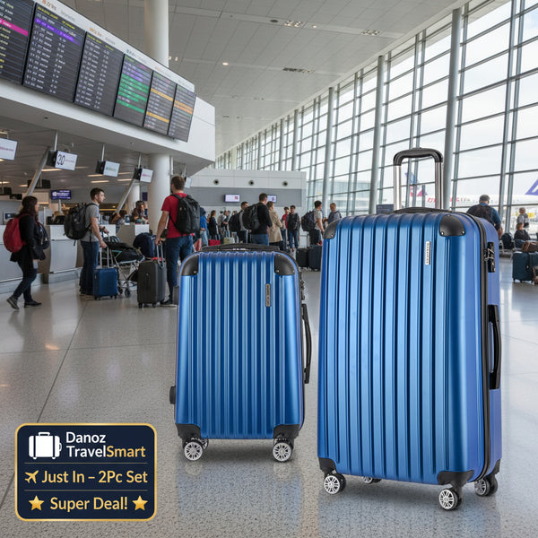Two blue suitcases with black handles and wheels on a gray background