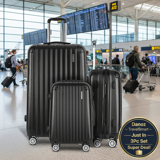 Three black suitcases of different sizes on a white background