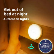 Automatic night light on a wooden surface with text 'Get out of bed at night Automatic lights'.