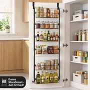 Kitchen pantry with a door-mounted storage rack filled with food items.