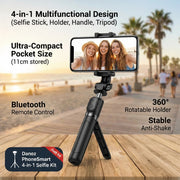 Multifunctional phone holder with selfie stick, holder, handle, and tripod on a wooden surface with palm trees in the background.
