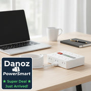 White power strip with multiple outlets and a digital display on a white background