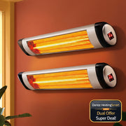 Two wall-mounted infrared heater strips glowing with orange light on a terracotta-colored wall, with a window frame and plant leaves visible at the edges.