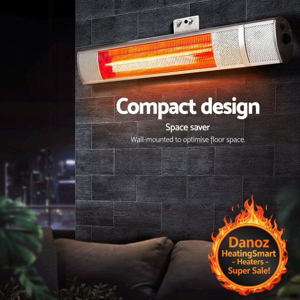 Wall-mounted infrared heater with text highlighting compact design and space-saving features, set against a dark tiled wall.