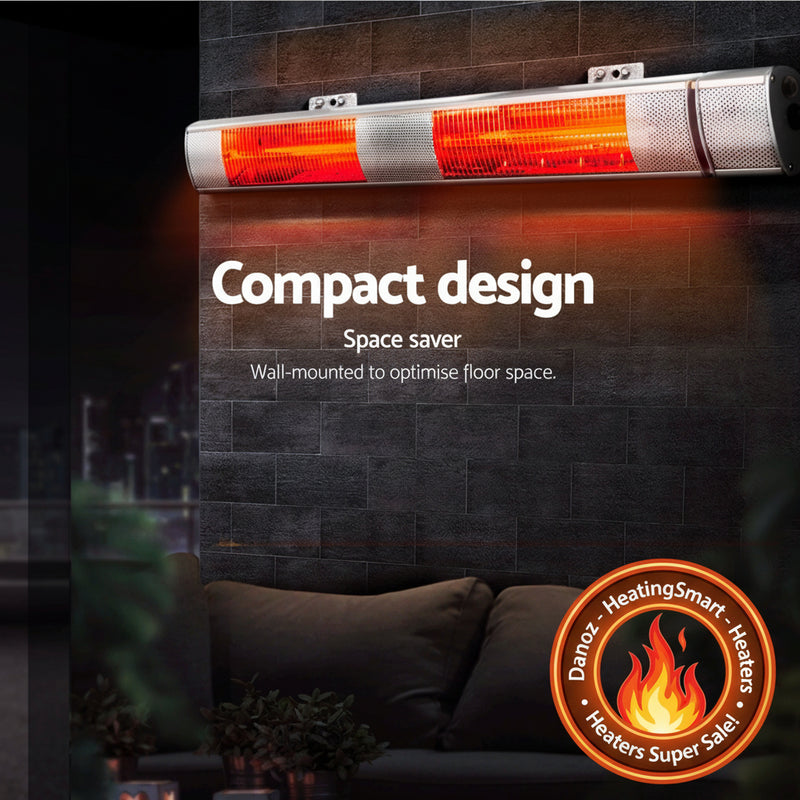Wall-mounted infrared heater with text 'Compact design' and 'Space saver' on a dark wall background.