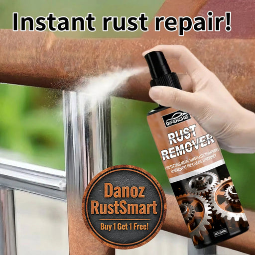 Rust remover being applied to a rusty metal surface with a glove on.