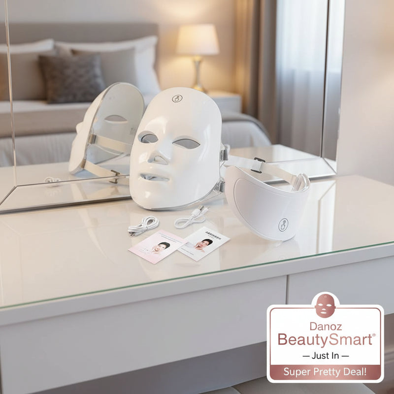 White LED face and eye mask with cables and user manual on a white background