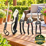 Set of gardening tools including a saw, shears, and pruners on a white background