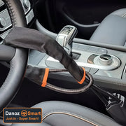 Steering wheel cover with orange accents on a car steering wheel