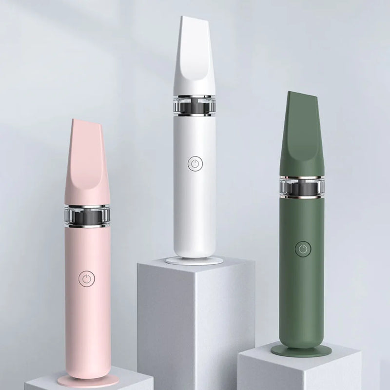 Three slim handheld electronic devices displayed on white pedestals against a light gray studio background. The devices come in three colors: pink, white, and sage green, each with a metallic silver band near the base.