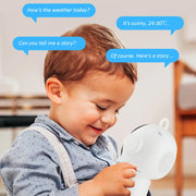 Child holding a white device with text bubbles indicating a conversation about weather and a story.