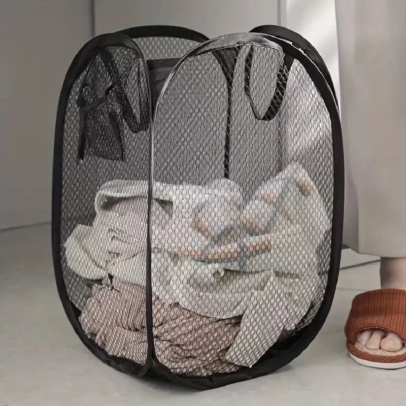 Buy 1 Get 1 Free - Tackle laundry day with a smile using Danoz Mesh Pop-up Laundry Basket! With its roomy, breathable mesh design, it keeps your dirty clothes fresh and well-ventilated