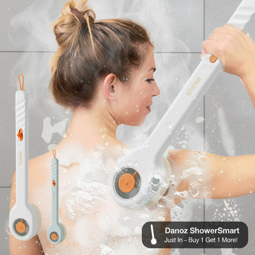 Woman using a handheld shower scrubber with soap suds on a white background