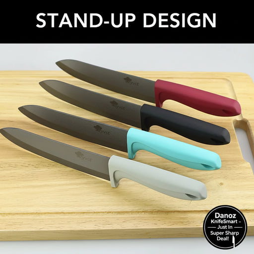Four kitchen knives with dark gray blades and colorful handles in red, black, turquoise, and light gray, arranged diagonally on a wooden cutting board. A black banner at the top reads 'STAND-UP DESIGN' in white text.