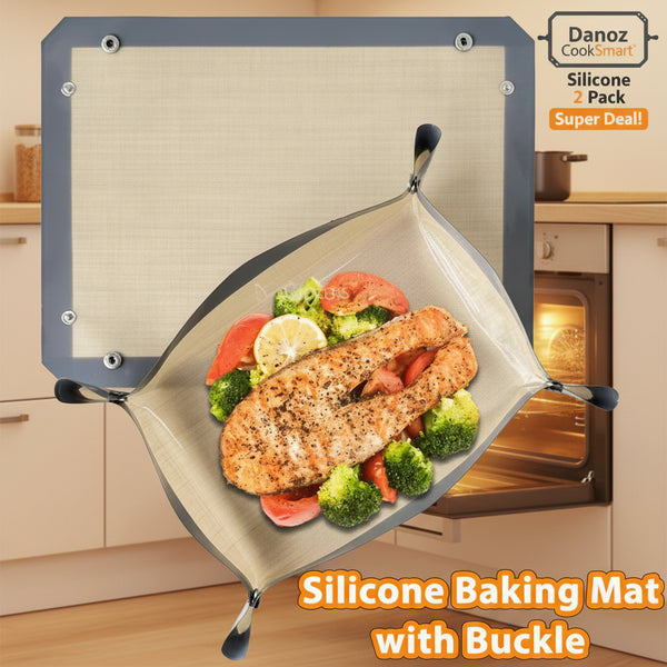 Silicone baking mat with buckle holding a cooked salmon fillet and vegetables on a white background.