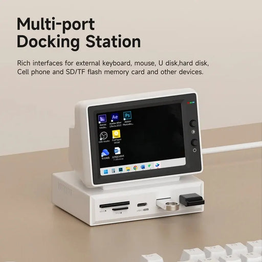 Multi-port docking station with screen displaying icons on a beige surface.