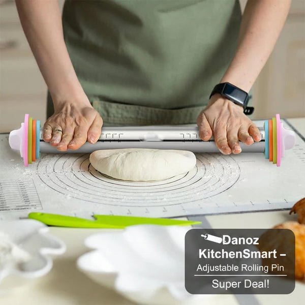 Person using a colorful rolling pin on dough with a kitchen setting in the background
