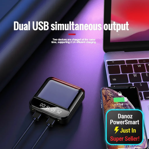Dual USB charger with smartphone and laptop on a dark background