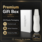 Promotional graphic for a premium gift box featuring an ultrasonic skin scrubber and its white packaging box on a black background with gold text and icons.