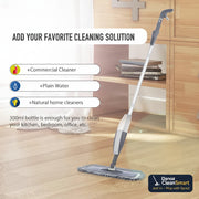 Spray mop on a wooden floor with cleaning solution options displayed.
