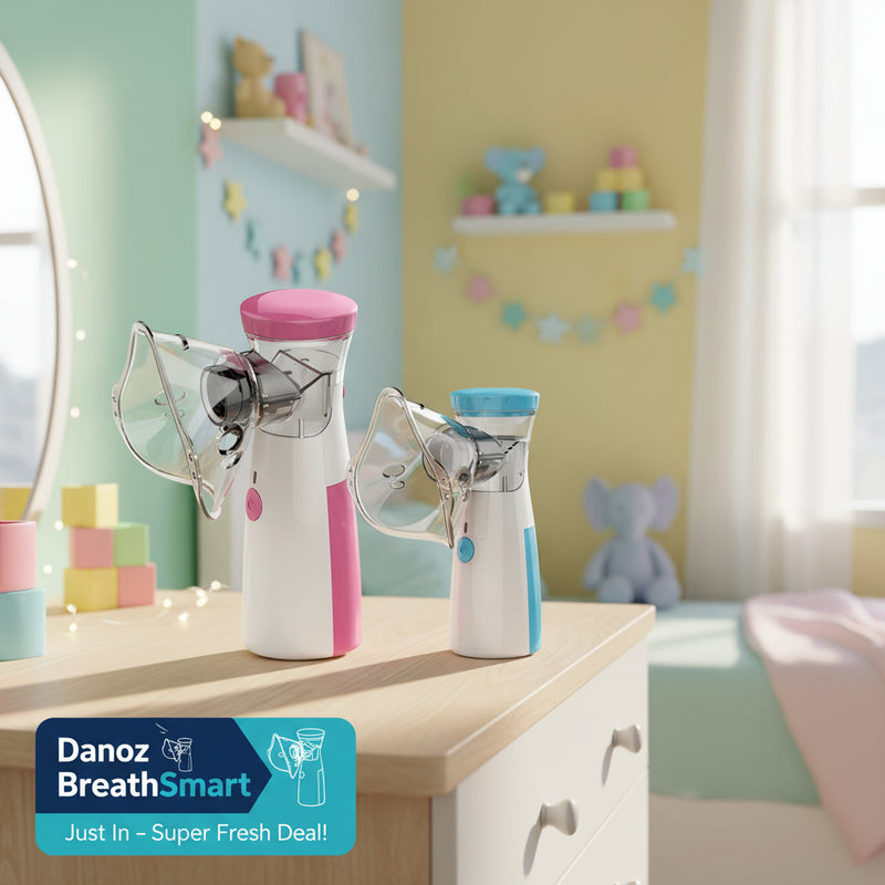 Two handheld nebulizers, one pink and clear, the other blue and clear, on a white background.