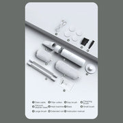 A product kit laid out on a white background with numbered callouts and a small instruction legend. The kit includes a white handheld device, two silver rods, two white brush heads, a white filter cotton piece, a small black brush, a white cable, and a printed instruction manual.