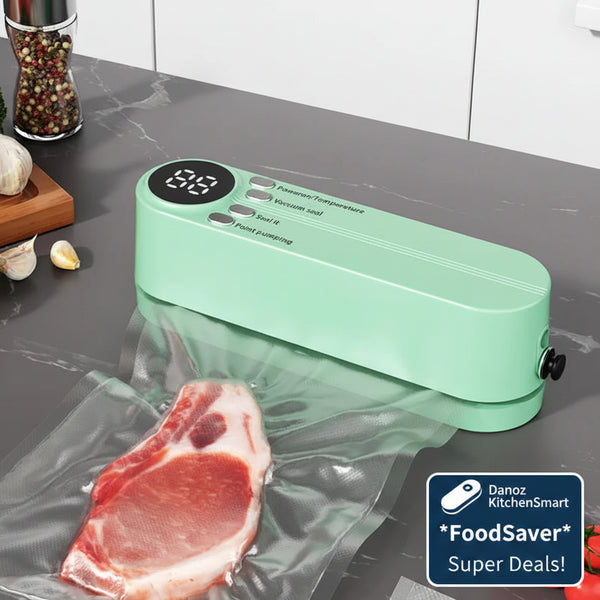 Green wireless handheld vacuum sealer on a kitchen counter with a piece of meat and tomatoes.