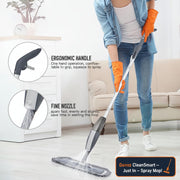Person using a mop with an ergonomic handle and fine nozzle in a living room.