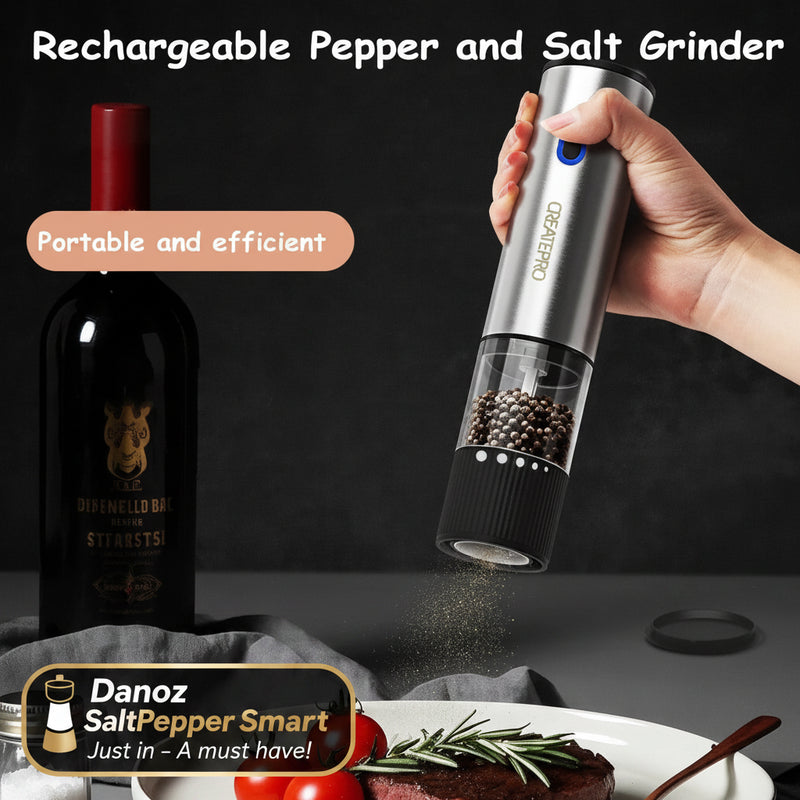 Rechargeable pepper and salt grinder being used over a dish with tomatoes and herbs, with a bottle in the background.