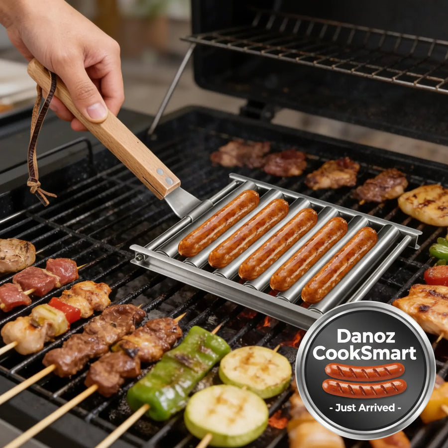Person grilling various meats and vegetables on a barbecue with a metal grill basket.