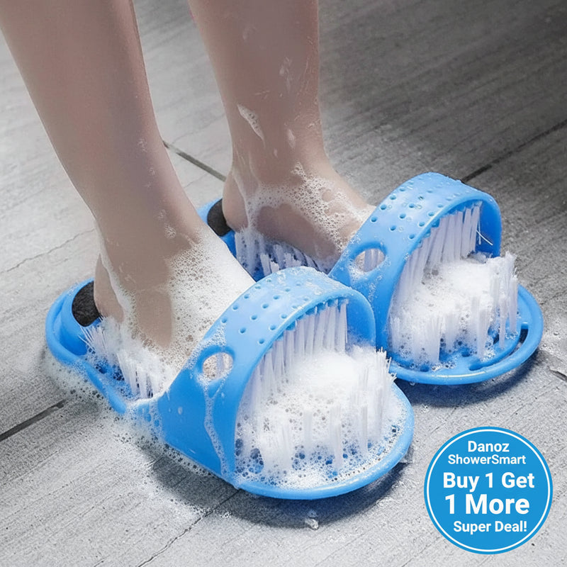 Blue foot scrubber shoes with bristles being used on feet on a tiled floor.