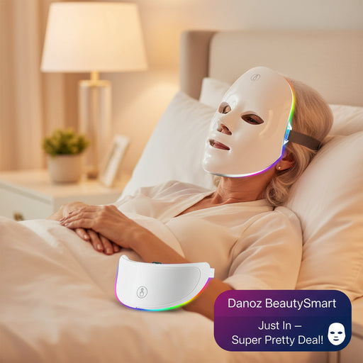 A white LED facial therapy mask shown from two angles on a clean white background, with multicolor light glowing through the eye and side cutouts.