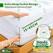 A white mattress topper with stretchable pockets shown fitted over a mattress in a bedroom setting, with hands demonstrating the pocket depth and a circular inset showing the pocket opening. Green and white text highlights the extra deep pocket design, 15-45 cm stretchable pockets, and 360-degree opening.