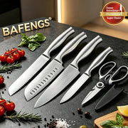 A 5-piece BAFENGS stainless steel kitchen knife set with a black-handled kitchen shears, arranged on a dark stone countertop with fresh rosemary, tomatoes, basil, and lemon slices. The BAFENGS brand name is displayed in gold letters in the upper left.