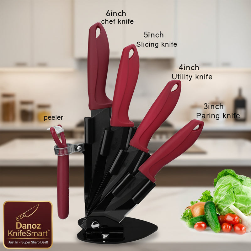 A 5-piece kitchen knife set with dark red handles and black blades in a black stand, shown on a white background with text labels naming each knife size and a peeler, plus a small vegetable garnish in the corner.