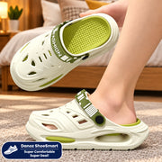 White and green sandals with 'Fashion' text on a gray floor.