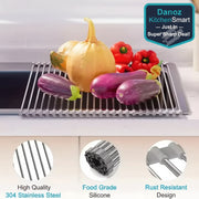 Metallic drain rack with vegetables on a kitchen counter, featuring text about material qualities.