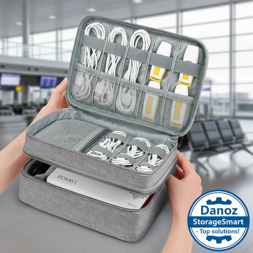 Gray travel organizer with electronic accessories, including cables and chargers, held by a hand.