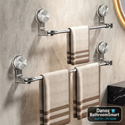 Towel racks with towels on a tiled bathroom wall